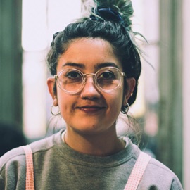 portrait shot of woman with round glasses